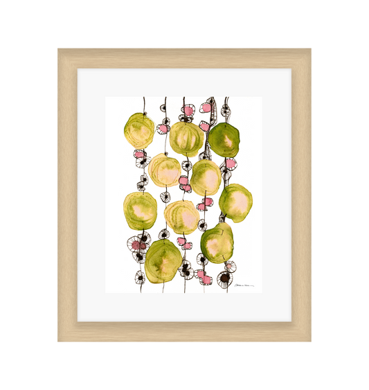 Framed artwork of colorful abstract design on a white background in a light wood frame