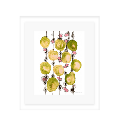 Decorative wall art with green and yellow abstract design on a white background in a white frame