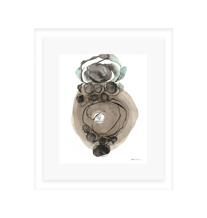 Framed abstract art piece with circular design on a white background in a white frame